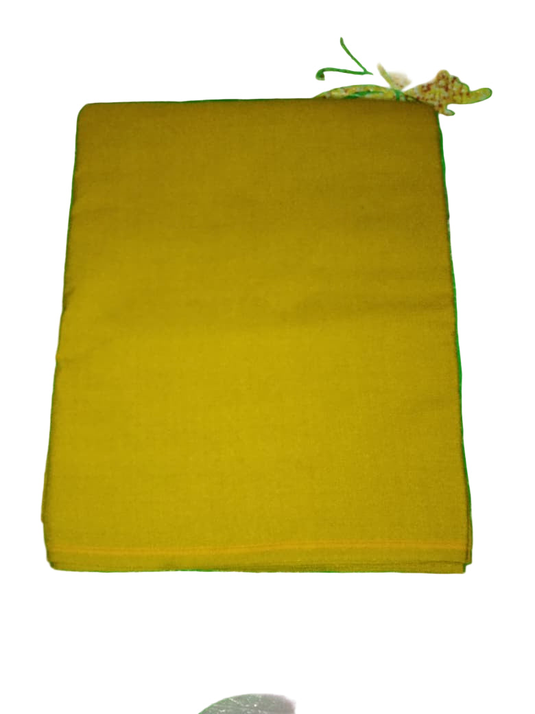 Yellow fabric on a green textured surface