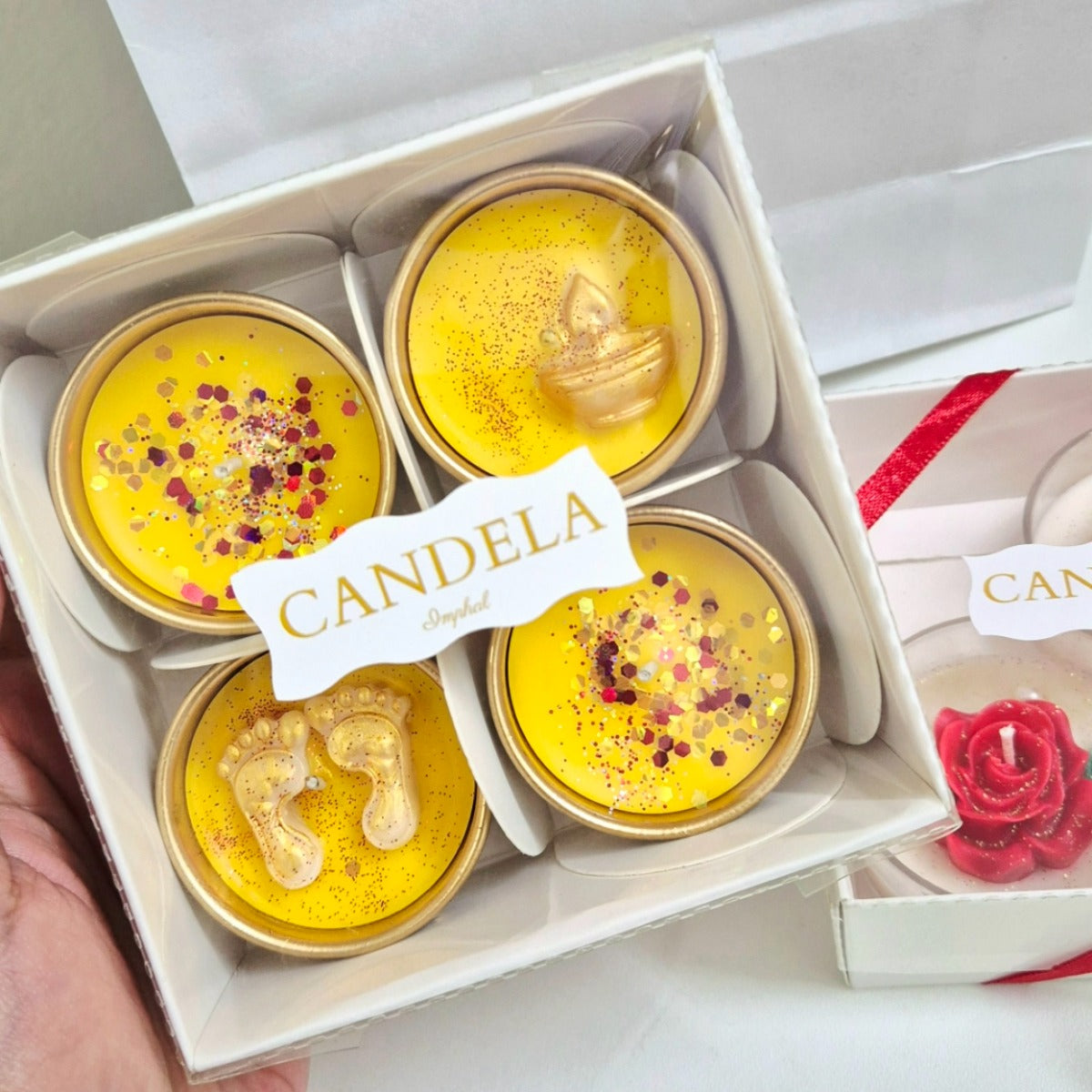 Blessed Diwali Diyas set of 4 in yellow and gold-toned containers with decorative festive embellishments by Candela Imphal.