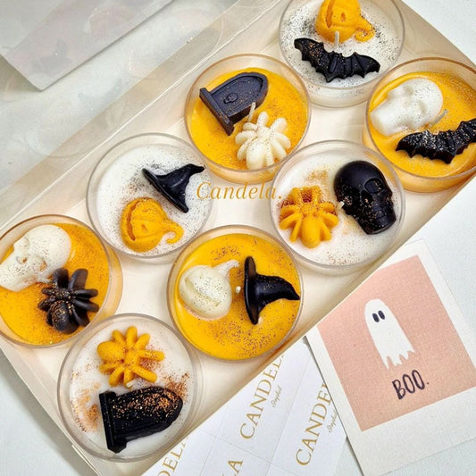 Halloween jumbo tealight candles with ghost, bat, pumpkin and witch-themed decorations