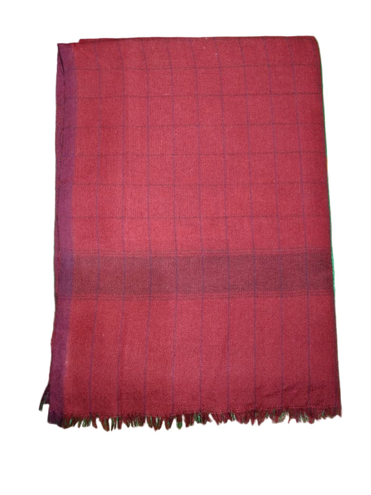 Red fabric on a green floral-patterned surface