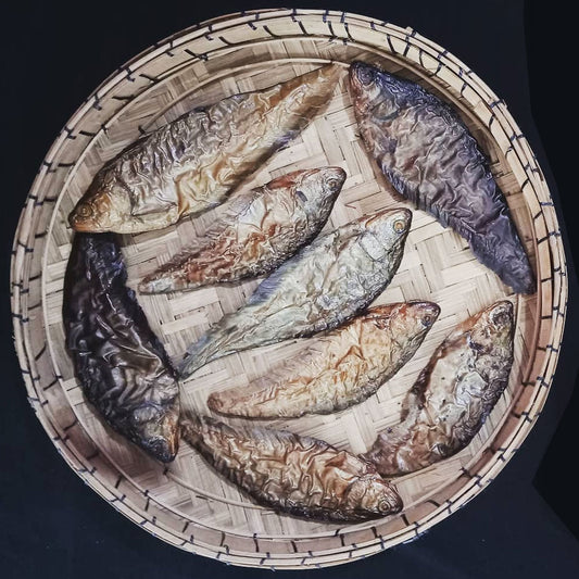 Ngapai smoked dry fish traditional Manipuri smoked whole fish on bamboo tray