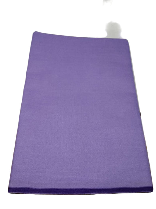 Purple fabric on a white surface with gold text and branding