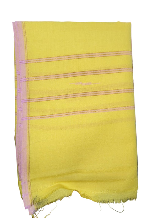 Yellow fabric with pink border held by a hand against a blurred background