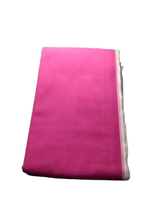 Pink fabric on a green textured surface