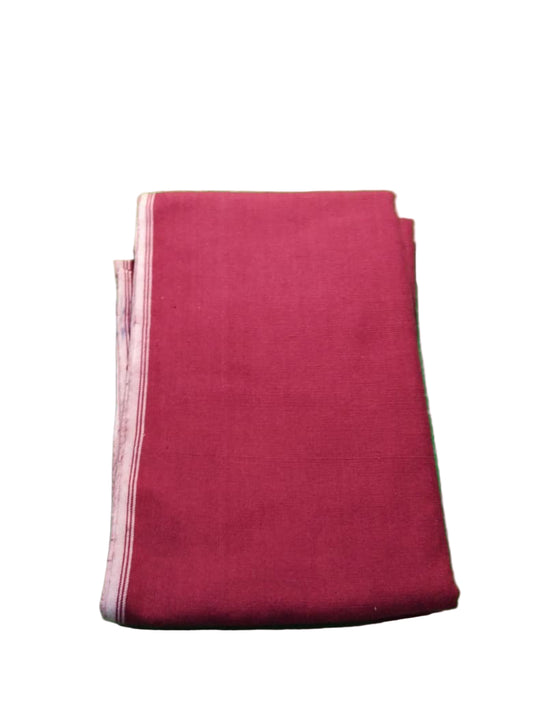 Folded red fabric on a green textured surface with butterfly designs