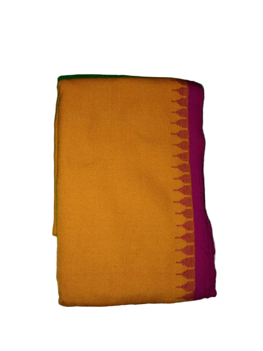 Yellow fabric with a pink border on a green cutting mat