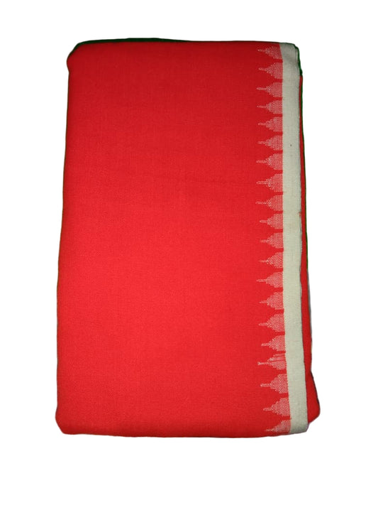 Red fabric with a white border on a green surface