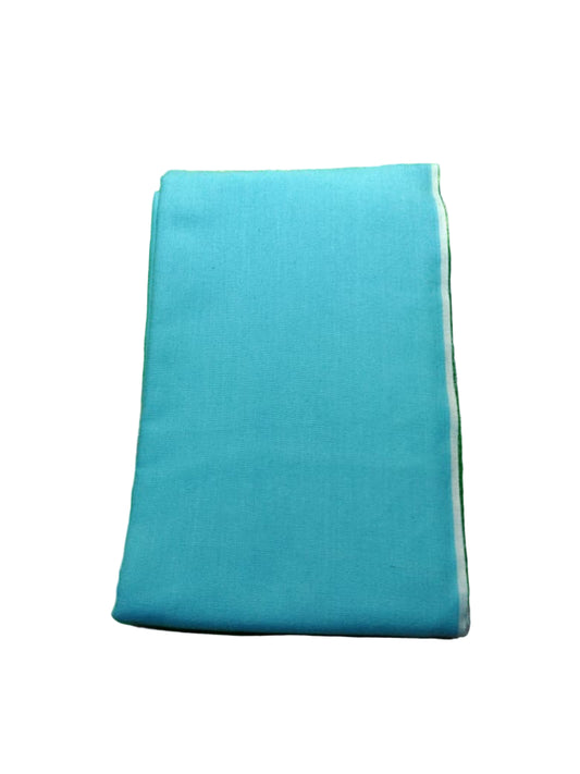 Blue folded fabric on a green textured surface